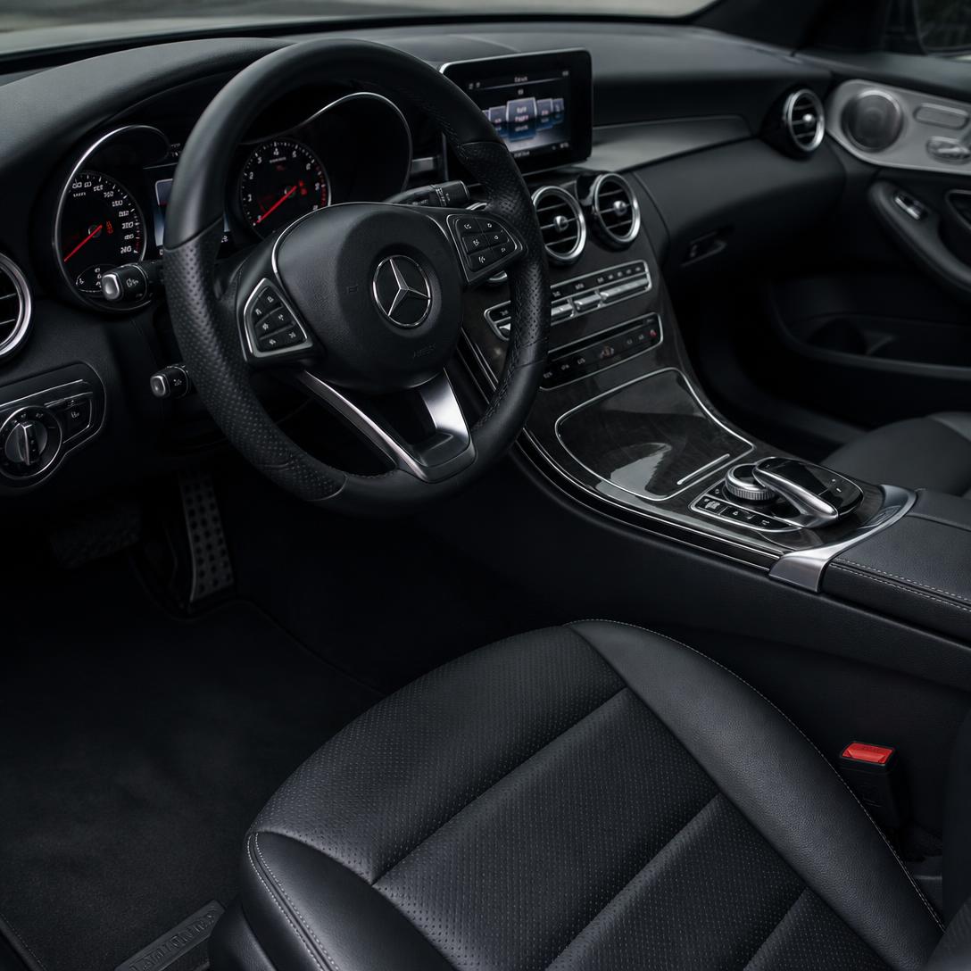 Spotless detailed car interior with clean leather seats and dashboard